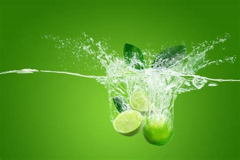 Premium Photo | Refreshing green lime in water isolated over green background | Dishwashing logo ...