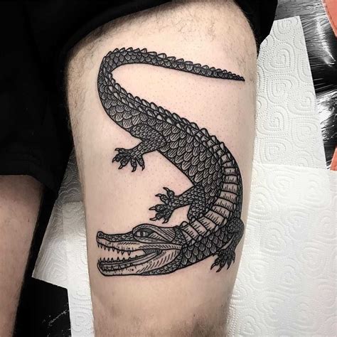 A large alligator tattoo by Deborah Pow inked on the left thigh - #alligator #Deborah #Inked # ...