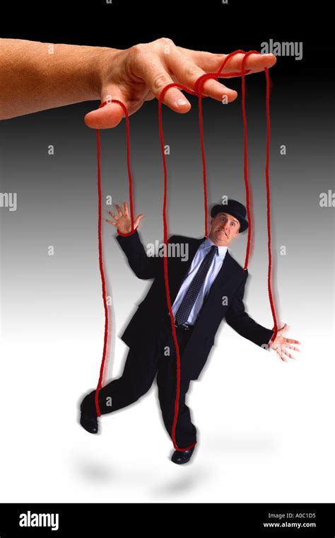 Businessman on puppet strings Stock Photo - Alamy