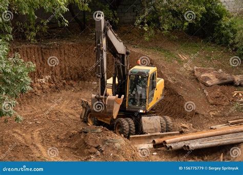 Loader Backhoe,excavator Digging a Trench,Work of Excavating Machine on Building Construction ...