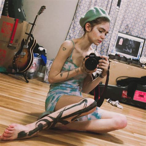 What do Grimes' tattoos mean? | The US Sun