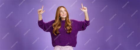 Premium Photo | Dreamy girl with red hair and freckles in warm cozy purple sweater raising hands ...