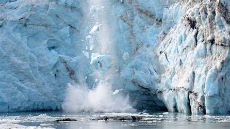 A glacier calving at Glacier Bay National Park in Alaska - National Park Trips