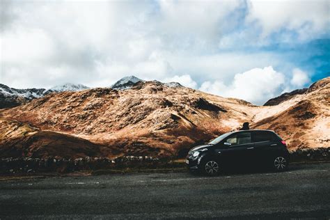 Curve Road Near Mountains during Daytime · Free Stock Photo