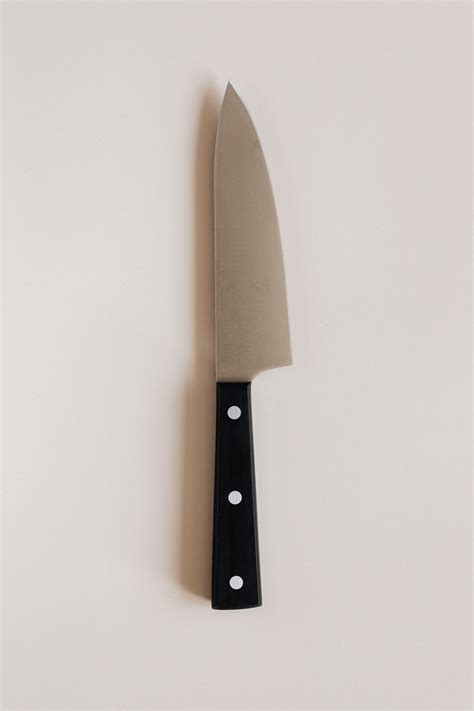 Kitchen knife on gray counter · Free Stock Photo