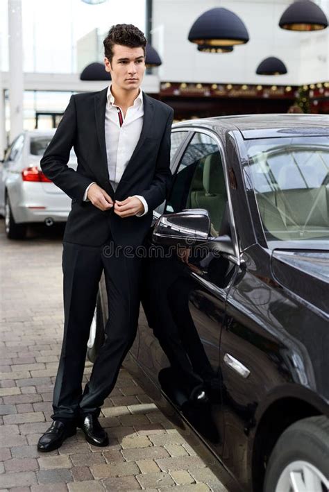 Young Handsome Man, Model Of Fashion, With Luxury Cars Stock Image ...