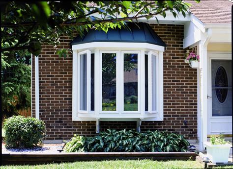 Exterior view of bay window above a garden Bay Window Ideas Exterior ...