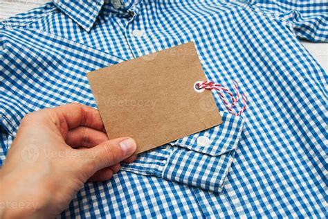 Checkered shirt with tag 5126184 Stock Photo at Vecteezy