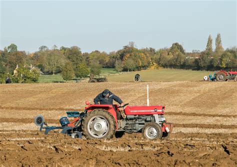 Two Old Vintage Red Tractors Ploughing Editorial Stock Photo - Image of equipment, cultivation ...