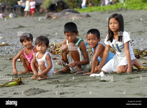 Children on the beach north of Manila Philippines Stock Photo - Alamy