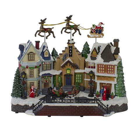 16" White and Brown LED Lighted and Animated Christmas Village with ...