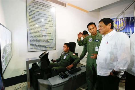 President Rodrigo Duterte checks the flight simulator used for training airmen - PICRYL - Public ...