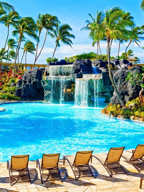 Swim under the waterfall to reach the water slide and whirlpool at Kona ...