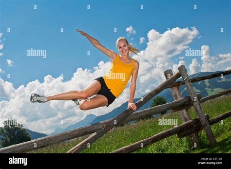 Adult jumping over fence hi-res stock photography and images - Alamy