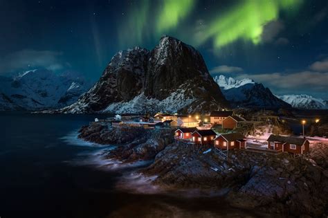 Northern Lights over Village in Lofoten, Norway by Raúl Podadera Sanz - Image Abyss