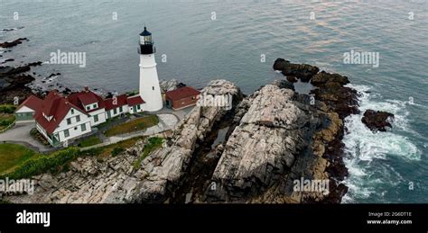 A lighthouse at sunrise Stock Photo - Alamy