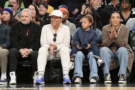 Queen Latifah treats young son Rebel to Harlem Globetrotters game with partner Eboni Nichols in NYC