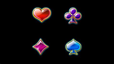 four different colored hearts, spades and diamonds on a black ...