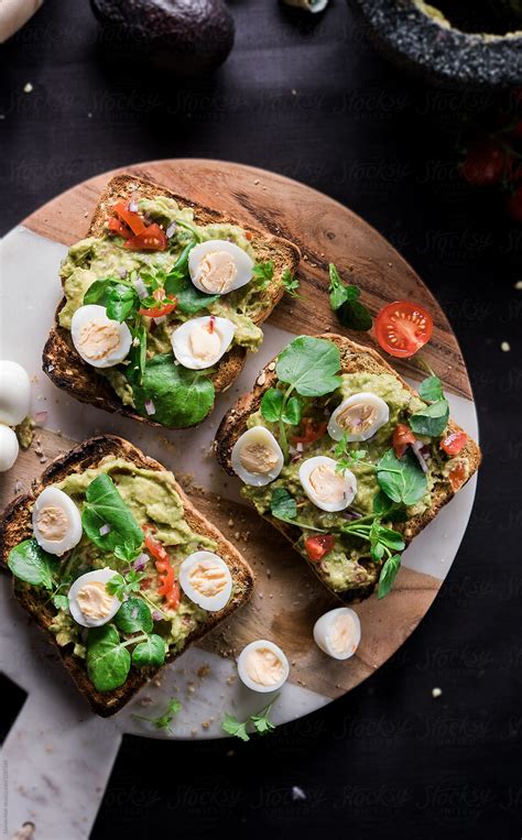 "Avocado Toast With Boiled Eggs." by Stocksy Contributor "Darren Muir" - Stocksy