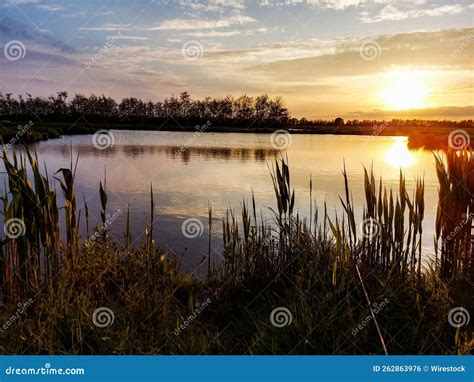 Beautiful Scenery of a Lake with a Reflection of Sunset Sky Stock Photo ...