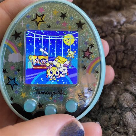 What is this screen that showed up with two people on it - tamagotchi on : tamagotchi