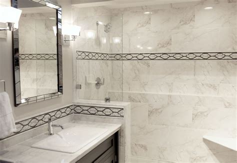 Get the look for less! Use a decorative border with a marble-like porcelain field tile to ...