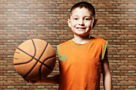 Smiling Kid with Basketball Stock Photo - Image of wooden, people: 51789822