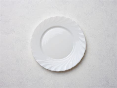 Premium Photo | Empty white plate on white background top view