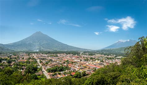 Panoramic View Of Antigua Guatemala With The Three Volcanoes Stock ...