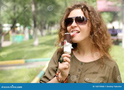 Young Woman Eating Ice-cream Royalty Free Stock Photos - Image: 16019968