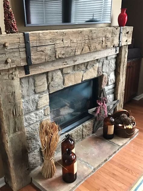 Hand hewn barn beam and forged straps. Fireplace mantle with natural stone | Rustic farmhouse ...