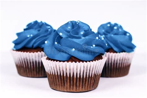 Three Cupcakes with Icing in Trendy Blue Color on Isolated White ...