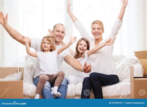 Smiling Parents and Two Little Girls at New Home Stock Image - Image of four, parenting: 39784137