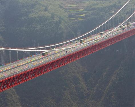 Sidu River Bridge, China – Height of 496 m (1,627 ft). This 1,222 m (4,009 ft) long suspension ...