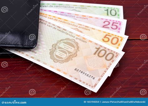 Netherlands Antillean Money in the Black Wallet Stock Photo - Image of ...