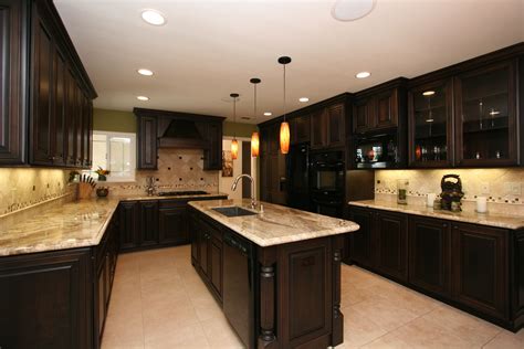 Dark cabinets with light countertops | Cheap kitchen remodel, Black kitchen cabinets