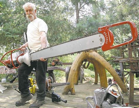 JOE BRYKSA / WINNIPEG FREE PRESS Logger Lawrence Feilberg holds a two-person 1951 Disston ...