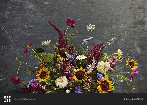 Flower arrangement on slate stock photo - OFFSET