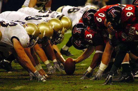 File:US Navy 031230-N-6213R-507 The Navy defensive line and Texas Tech offensive line square off ...