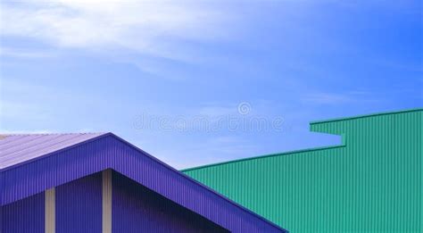2 Corrugated Metal Roof of Industrial Warehouse Buildings in Modern Style Against Blue Sky Stock ...