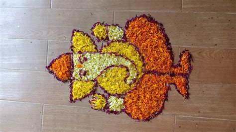 Lord Ganesh rangoli design in marigold flowers by Janya's creation - YouTube