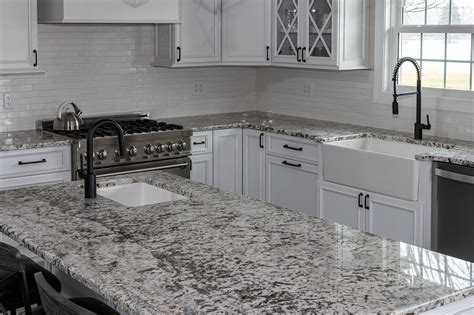 White kitchen with speckled pearl granite countertops | White granite kitchen, Granite ...