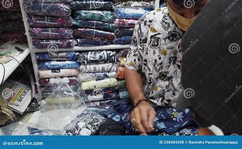 A Sales Man Showing Cloths To Customer Inside the Shop Stock Footage - Video of congested ...