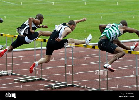 Men`s sprint hurdles race Stock Photo - Alamy