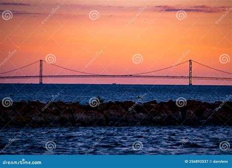 Mackinac Bridge at sunset stock image. Image of dawn - 256892037