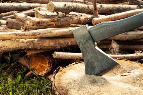 Premium Photo | An axe for chopping wood. harvesting firewood for the winter to heat the house.