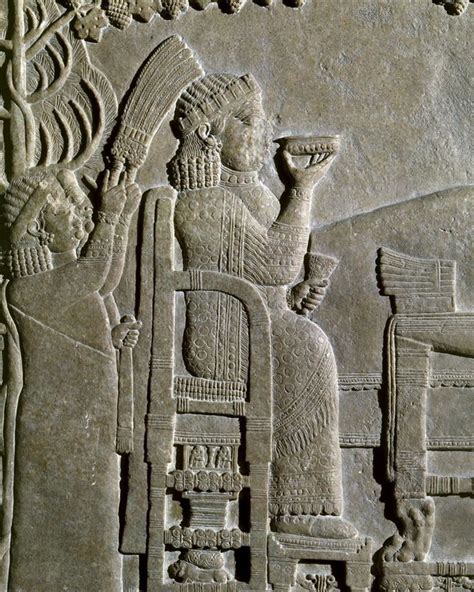 This carved relief shows King Ashurbanipal’s queen feasting in a garden ...