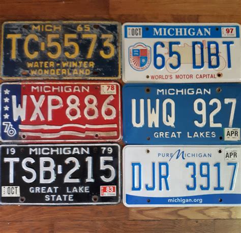 My Michigan license plate collection. Which one would you bring back? : Michigan