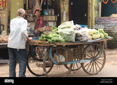 A vegetables seller with his cart on the road of Varanasi Stock Photo ...