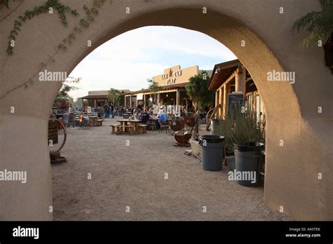 Arched entrance to San Tan Flats restaurant at foot of San Tan Mountains in Queen Creek, Arizona ...